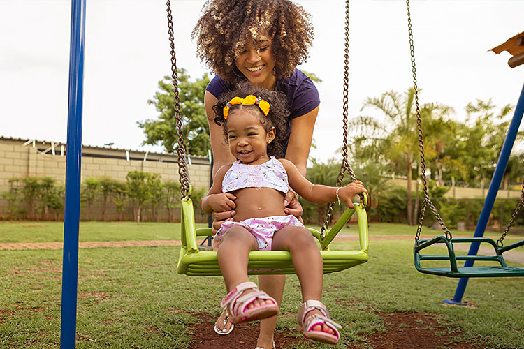 Mom and her child on a swing